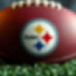 Pittsburgh Steelers logo with a football background